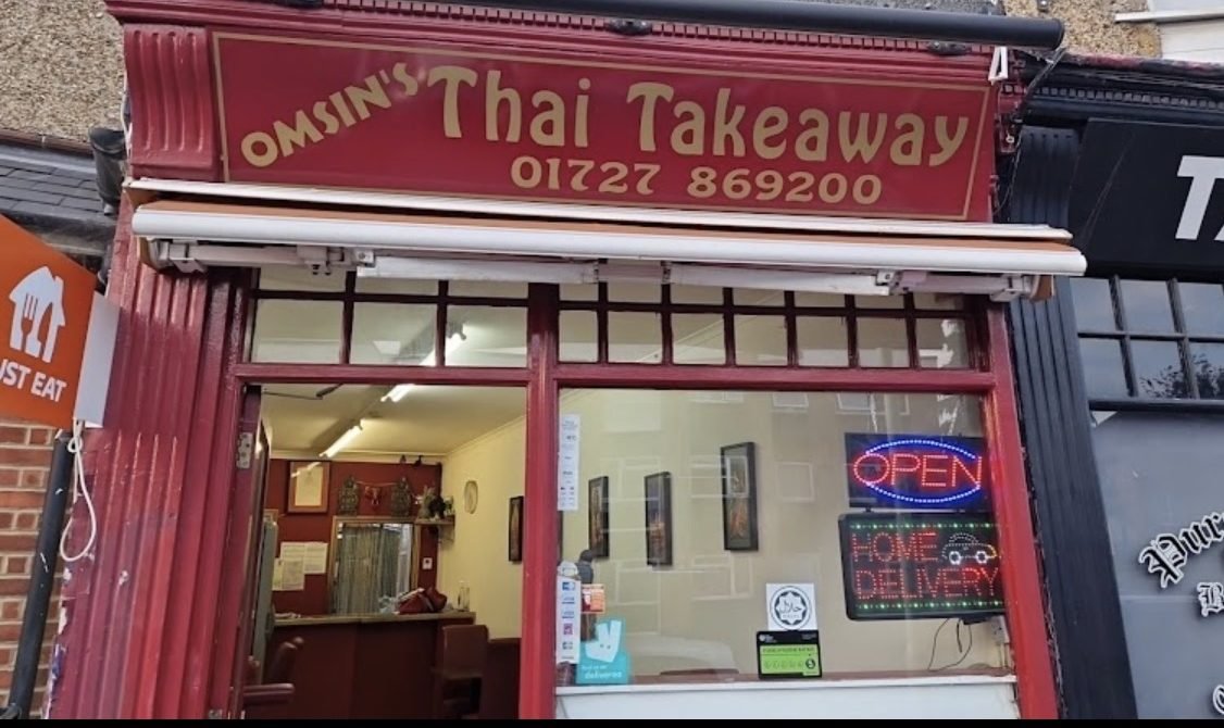 Omsin's Thai Takeaway shopfront on Hatfield Road, with burgundy signage and gold lettering